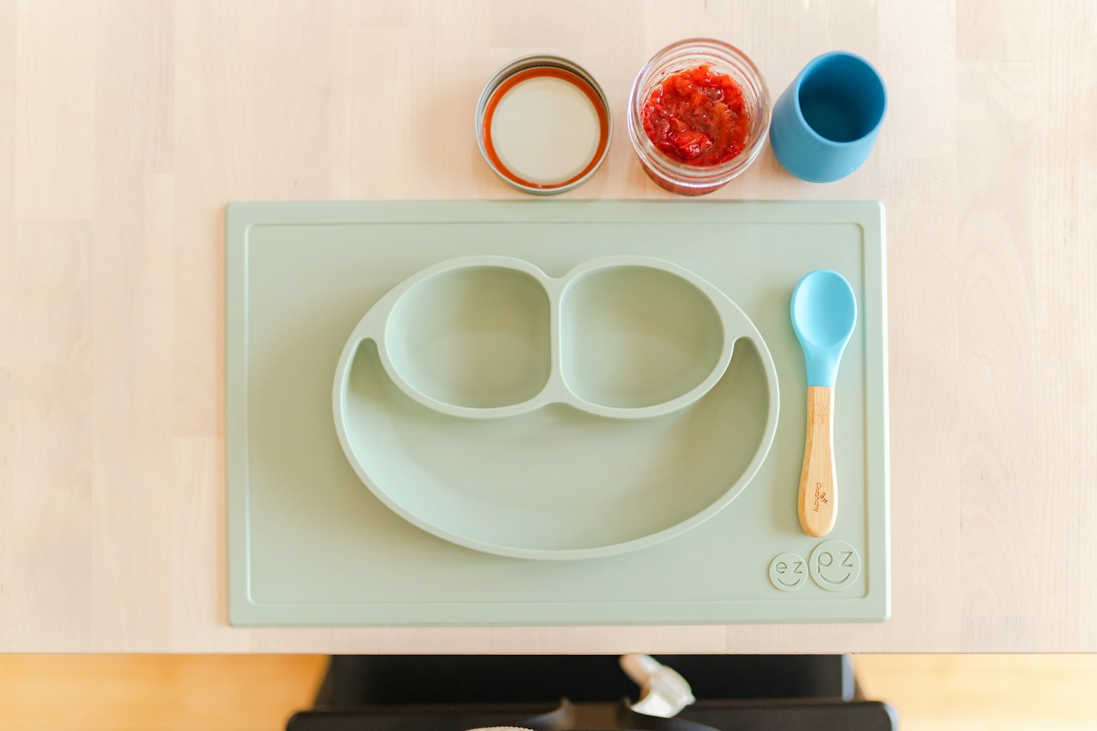 Photo by Carrie Allen www.carrieallen.com a child's plate with two spoons and a spoon rest on a stove