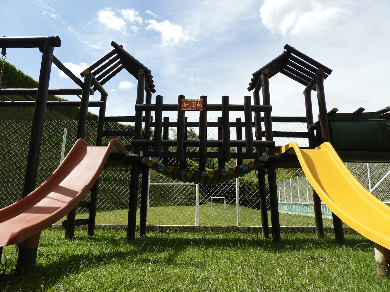 Photo by Julia Mayo black wooden chairs on green grass field during daytime